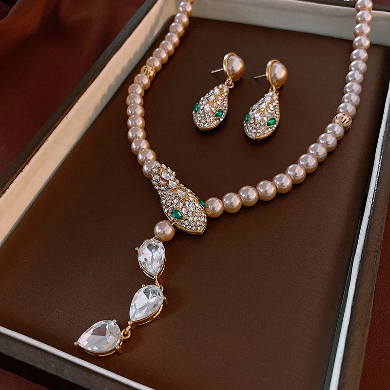 Diamond snake pearl necklace earrings medieval