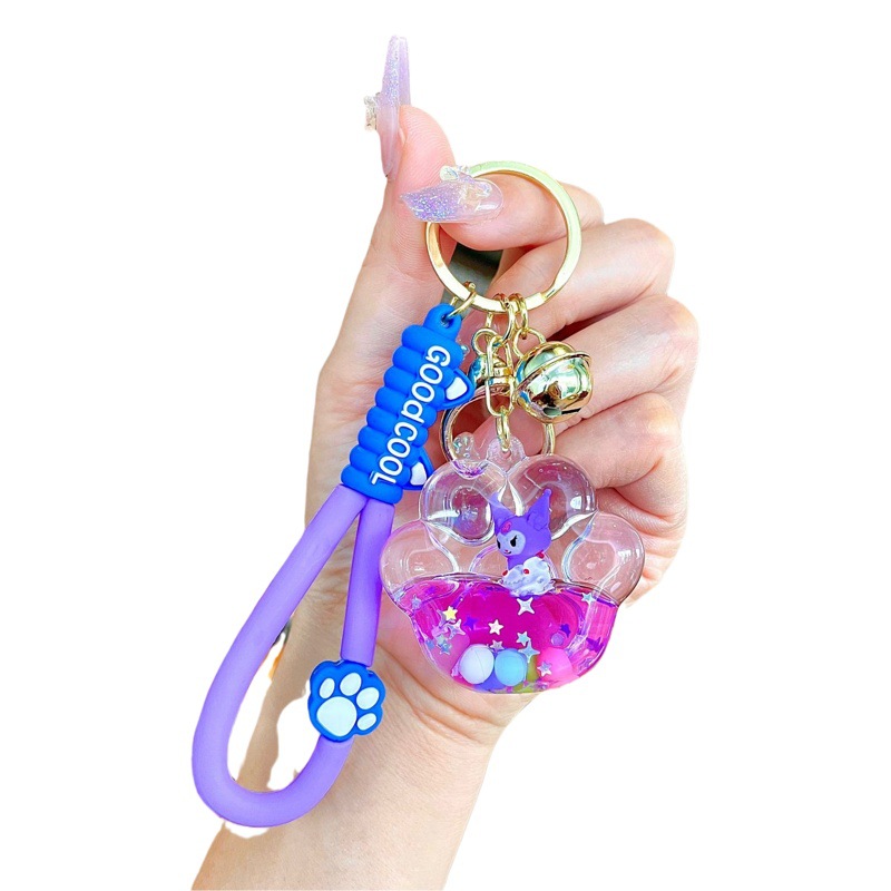 Aceite de gato garra arenas movedizas llavero lindo dibujos animados cadena colgante captura muñeca máquina agarrar pequeño regalo al por mayor