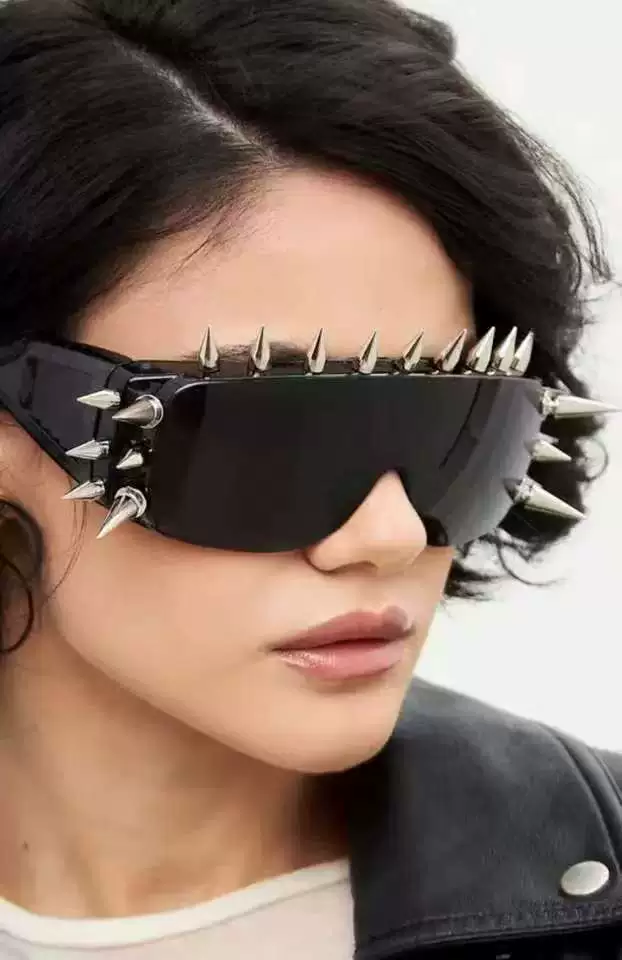 Sunglasses punk style, spike-studded fashion shades, black tinted lens