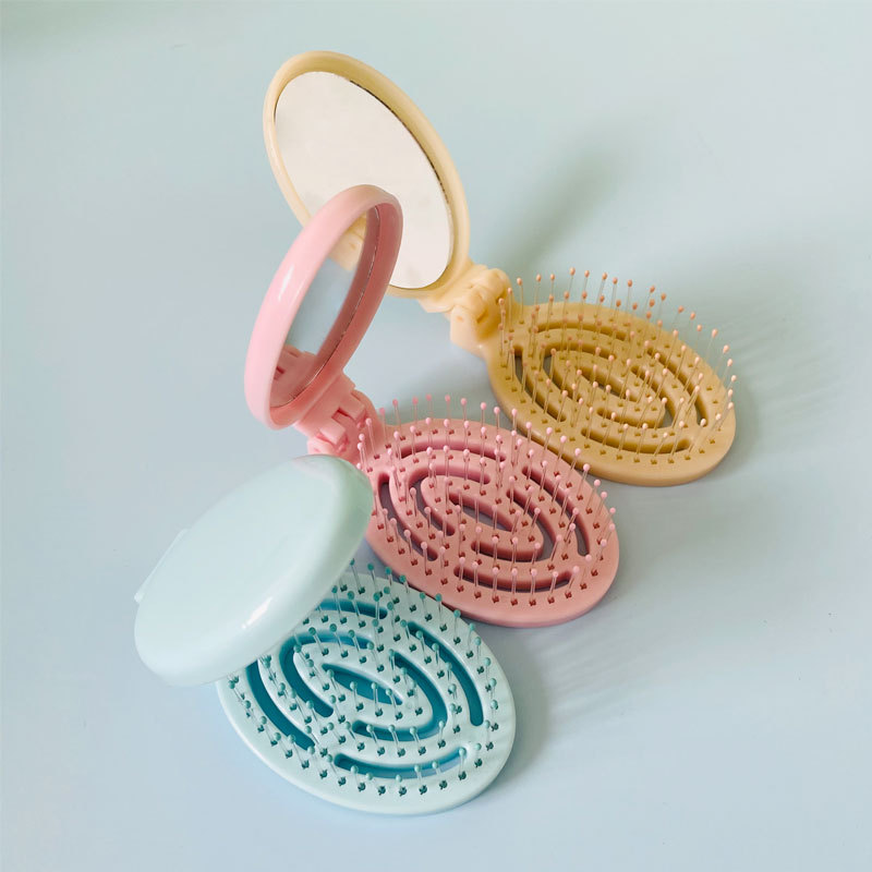 Hogar portátil de viaje cojín de aire peine hueco plegable masaje peine mini hueso contar peine pequeño con espejo al por mayor