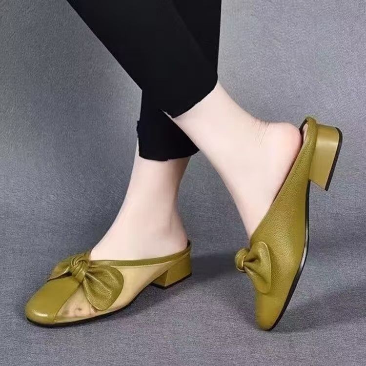 Zapatillas de piel suave de tacón bajo para mujeres primavera y verano 2026 nuevas zapatillas de tela plana para la cabeza de la bolsa para usar zapatillas de mujer