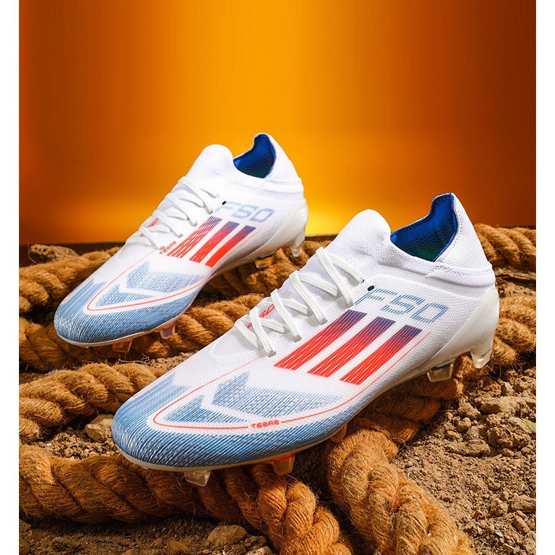 Fábrica al por mayor nuevo F50 baja zapatos de fútbol juveniles clavos de hierba zapatos de fútbol de competencia profesional
