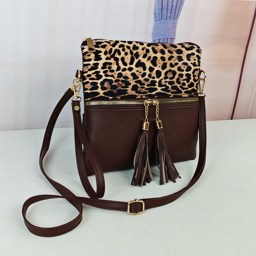 Bolso de leopardo de mujer bolso de moda europeo y americano nuevo bolso inclinado de hombro único bolso de color de choque ultrafino bolso de mano con borlas