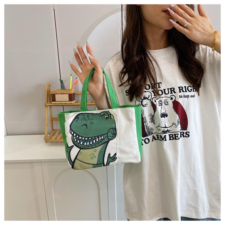 Cute cartoon printed small bag, 2024 summer new style hand-held piggy girl handbag, student storage canvas bag undefined