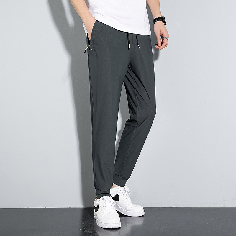 Pantalones delgados de verano de los hombres de ocio pantalones largos Pantalones deportivos elásticos de secado rápido hombres sueltos fertilizantes más tamaño al por mayor
