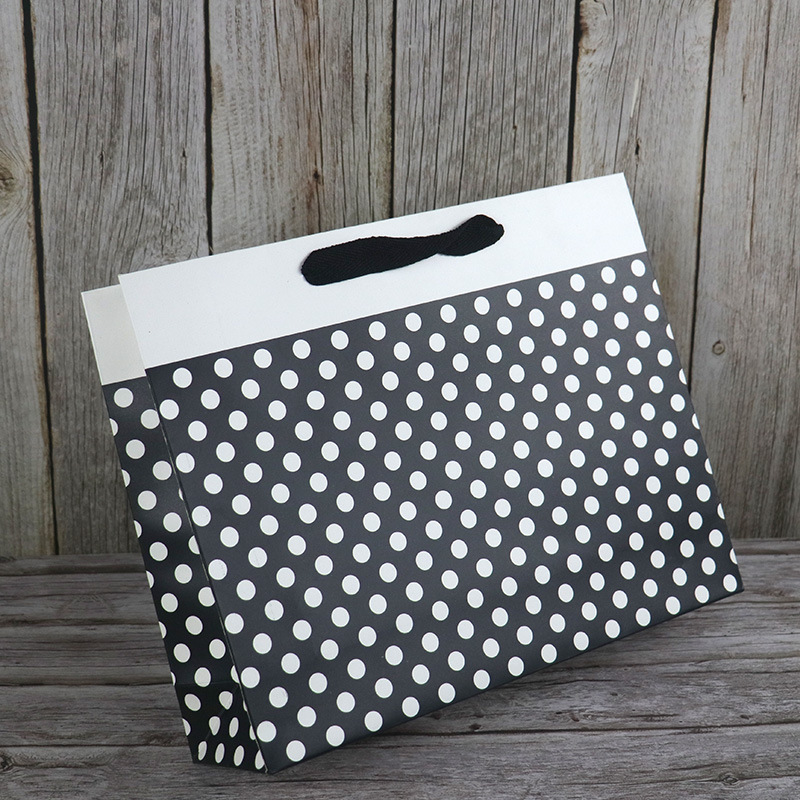 白卡纸袋现货时尚黑色圆圈服装店高档购物手提纸袋送礼广告礼品袋