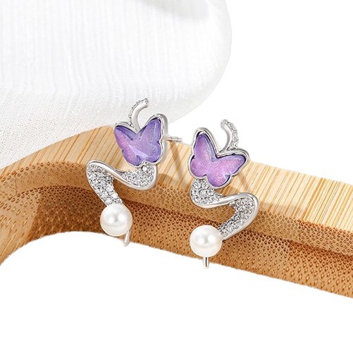 Xuping gemas artificiales de piedra moca mariposa pendientes de nicho femenino diseño de viento dulce perla pendientes de orejas