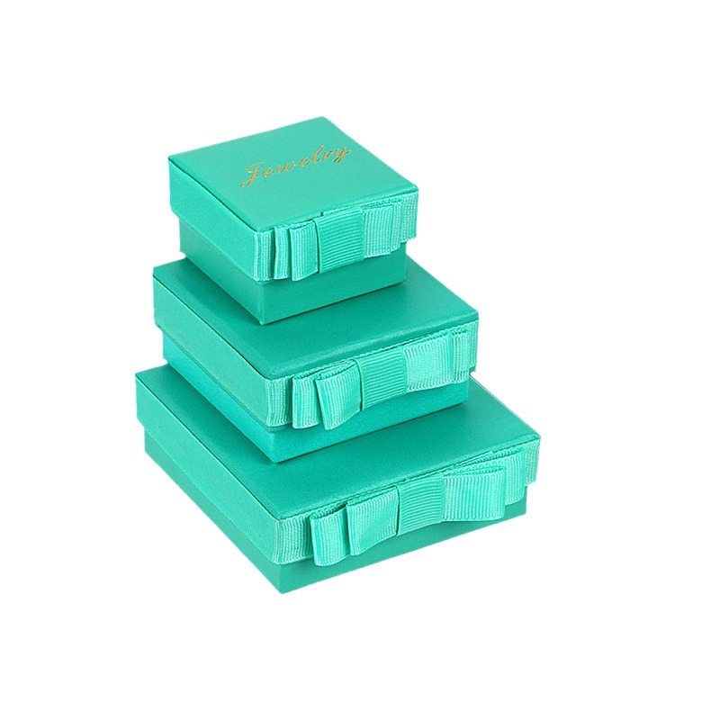 Inventario al por mayor arco cinta joyería embalaje de joyería caja de cartón simple anillo collar caja de regalo