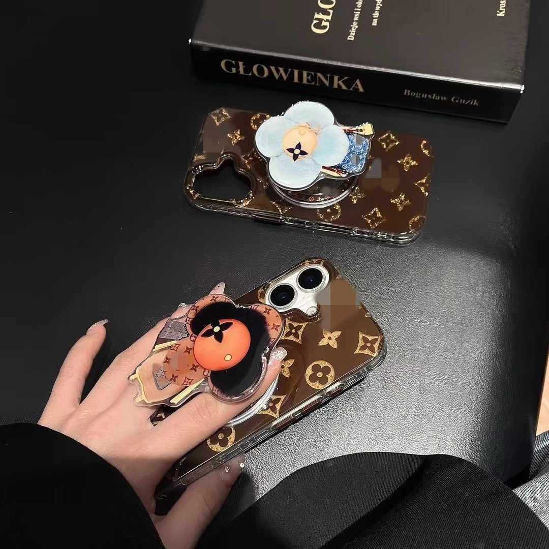 新型高級マグネットスタンドマグネット式携帯ケース通用太陽花マグネット式エアバッグスタンドはおしゃれで豪華です。