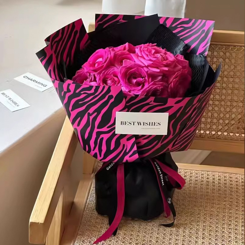Fábrica de fiestas de flores al por mayor leopardo transfronterizo papel de embalaje de flores nuevo ramo de flores papel de embalaje de regalos florista