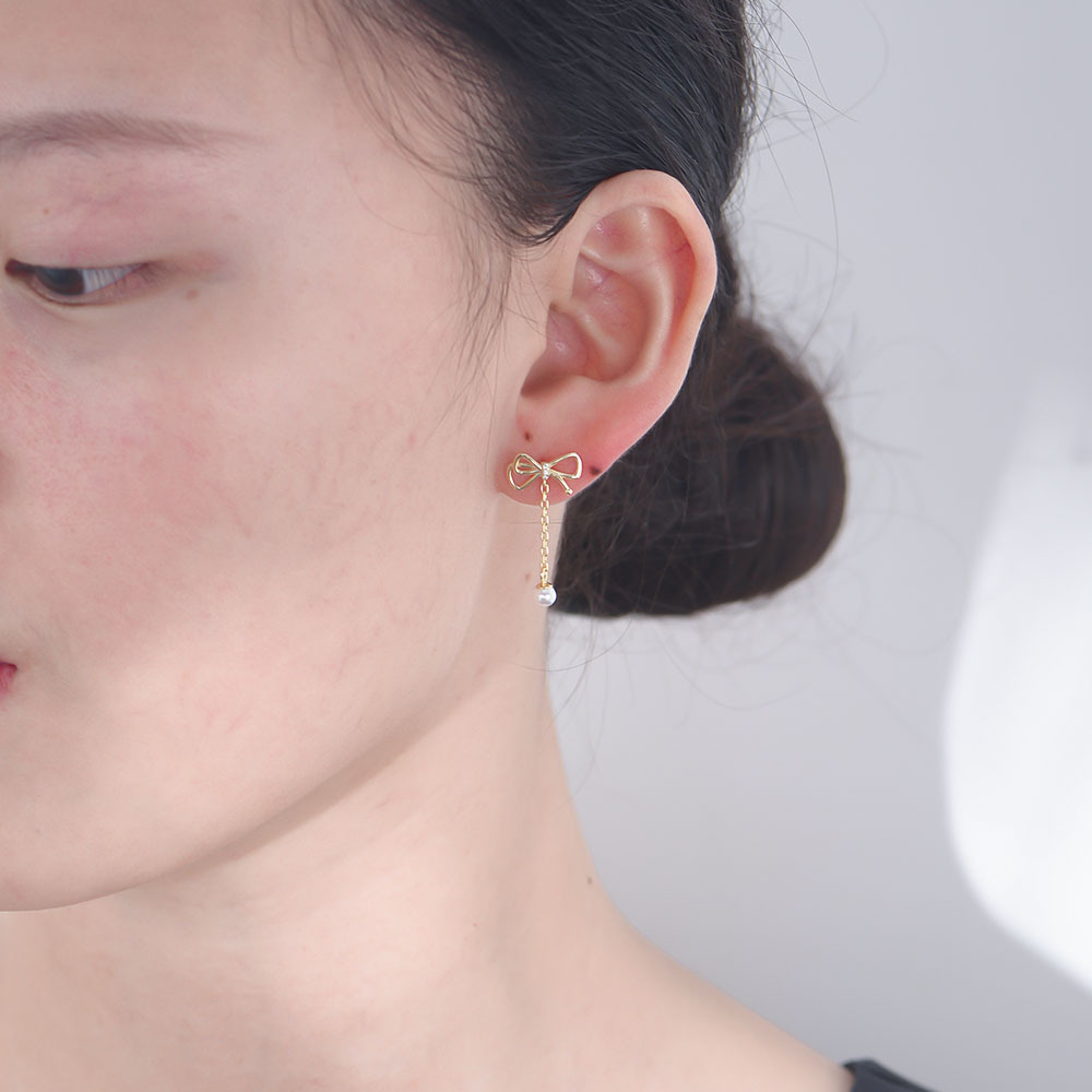 Súper Hada borla arco perla pendientes de las mujeres elegante luz de lujo de alto grado de plata esterlina pendientes de joyería de oído de Europa y América al por mayor