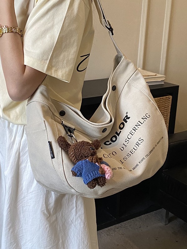 Bolsa de lona para mujeres 2026 nueva bolsa de gran capacidad transfronteriza impresa letras de viaje casual mochila de hombro