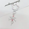 White keychain with bow, flowered