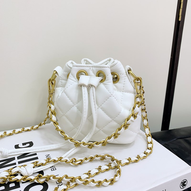 Bolso de hombro para niños y niñas Lingge de moda, cordón de aire extranjero, bolso de cubo de bebé de color sólido simple, nuevo bolso de cadena para niños