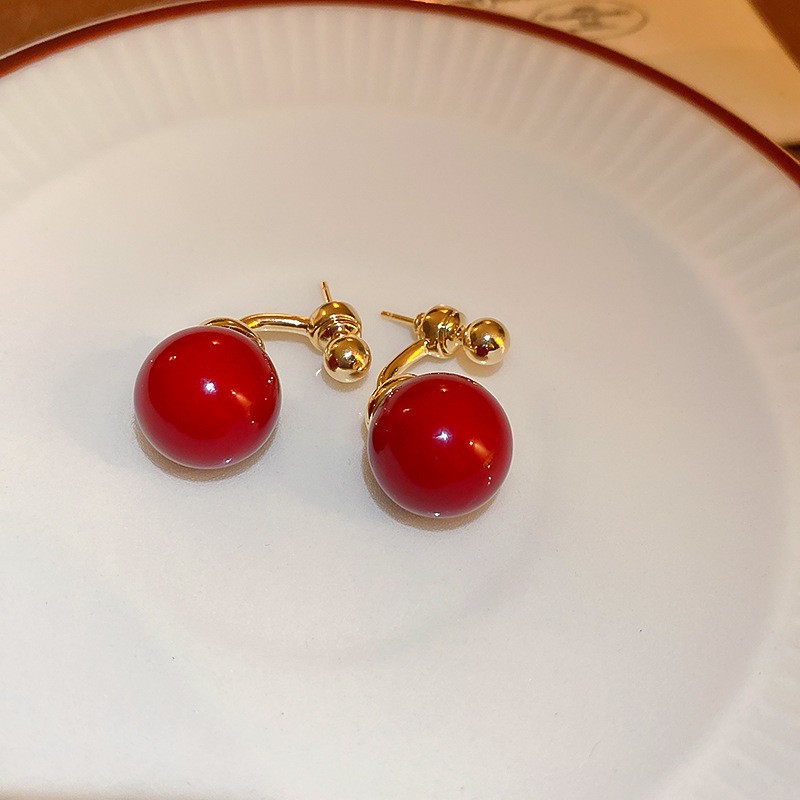 Pendientes de amor con goteo de aceite rojo con aguja de plata, botones de oreja de temperamento de moda de nicho, pendientes simples y de alta gama de estilo de Hong Kong