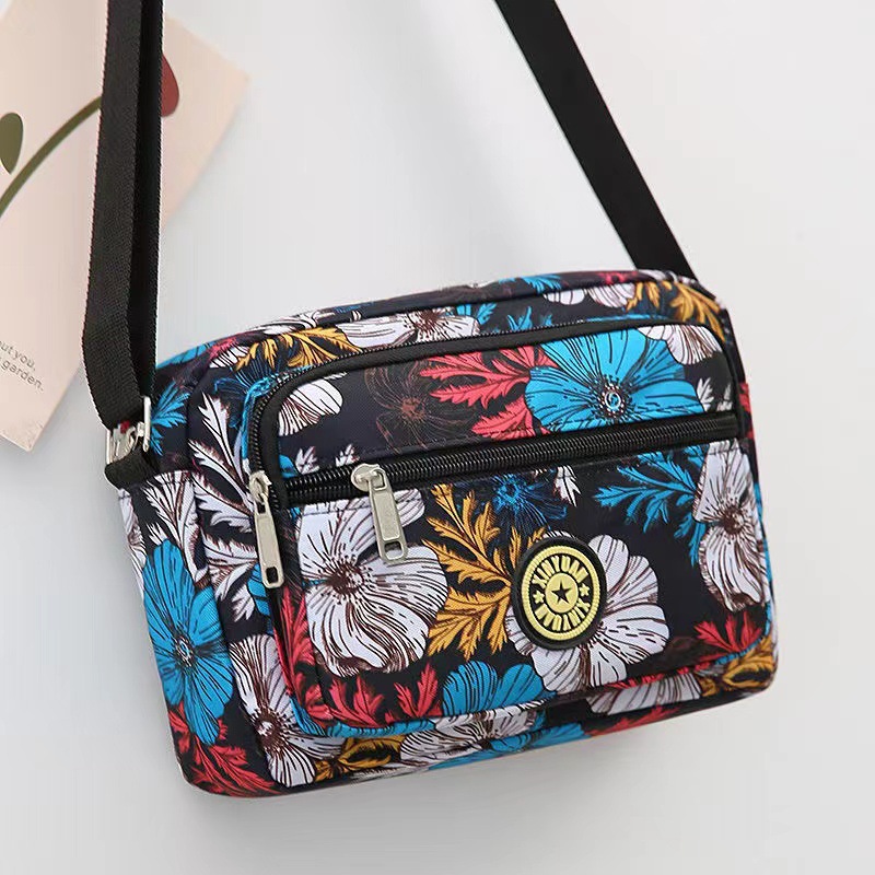 Bolsa de tela de flores bolsa de mensajero de las mujeres nueva bolsa de Madre de gran capacidad bolsa de hombro individual de mediana edad y ancianos bolsa de tela Oxford bolsa