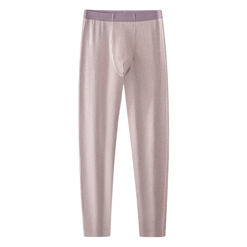 Otoño e invierno nuevos pijamas de algodón de colores dos en uno sin costuras para hombres, leggings, pantalones cálidos, pantalones finos de otoño de color puro en stock