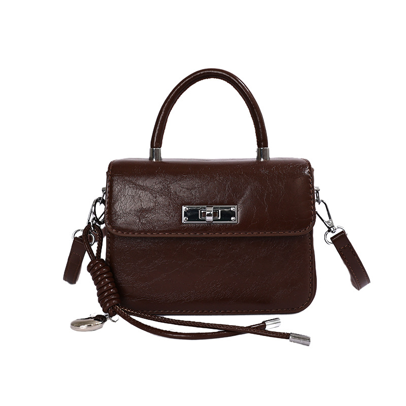 2026 nueva moda de alta sensación bolso bolso pequeño bolso cuadrado de mujer bolso de hombro de estilo extranjero bolso de transporte diario