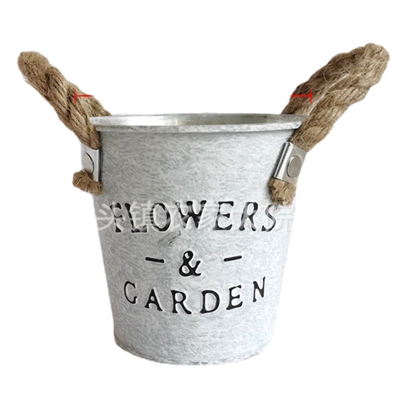 アマゾンのホットモデル工場の源はレトロな鉄芸の花桶の植木鉢の置物の田園の家の装飾の鉢植えの花器です。