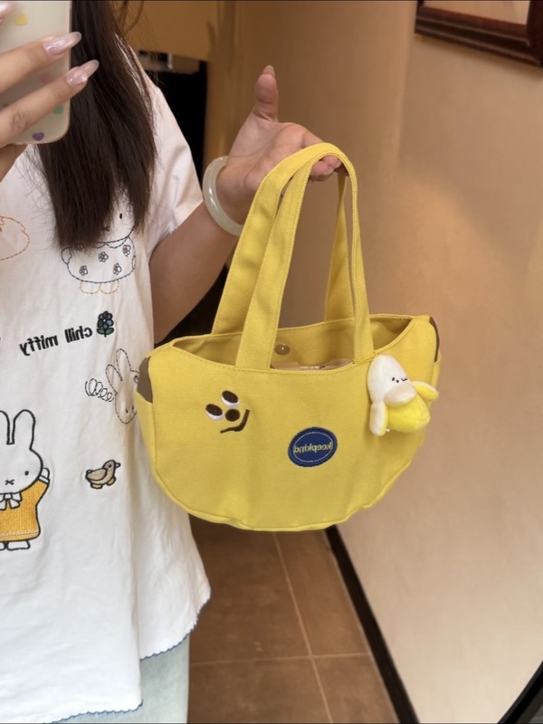 新しい可愛いバナナ刺繍ハンドバッグ、持ち運びに便利なキャンバスバッグ、会社員やお母さん向けの外出用小物入れ|undefined