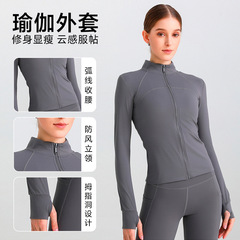 ヨガの服は春と秋の外にランニングフィットネスの長袖の女性のスタンドカラーのスリムなカーディガンのコートを着ます。