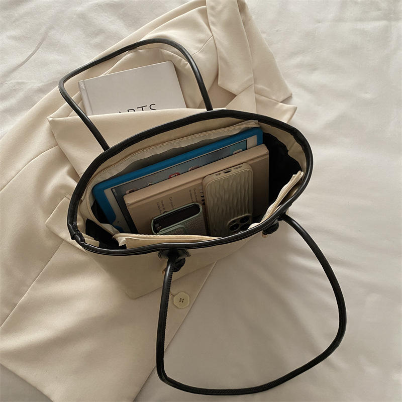 Bolsos retro de alta calidad de gran capacidad para damas 2024 nuevo bolso de hombro de viaje de otoño e invierno bolso portátil