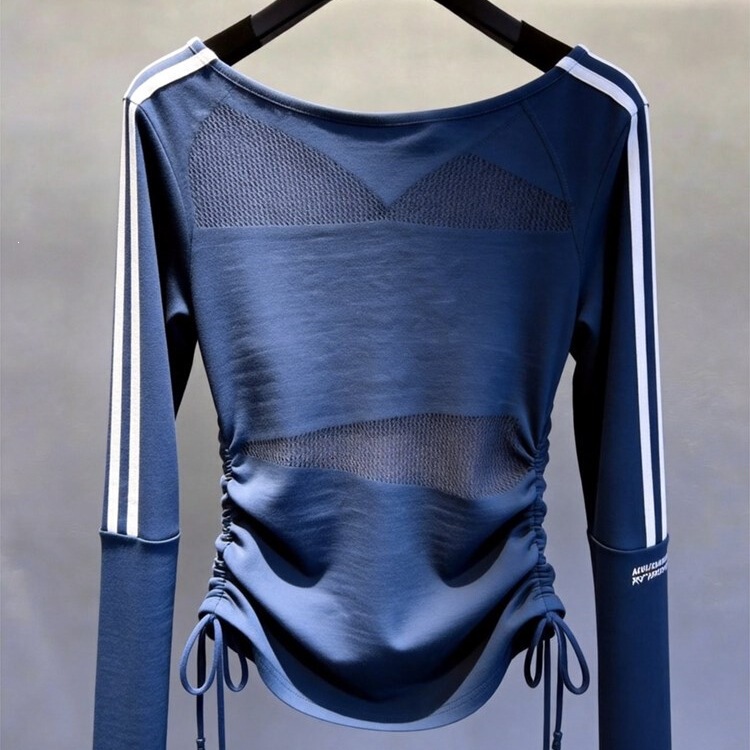 French-style blue hollow-out top with an asymmetrical hem, a new autumn 2026 collection featuring a light luxury aesthetic, a unique and minimalist design, and a stunning look
