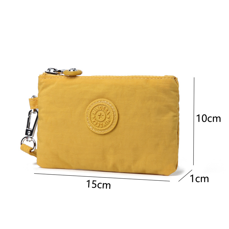 Bolso de tela de nylon de mujer simple bolso pequeño pequeño pequeño bolso de cambio delgado mini bolso de tarjeta de una sola capa de bolso de mano de mujer