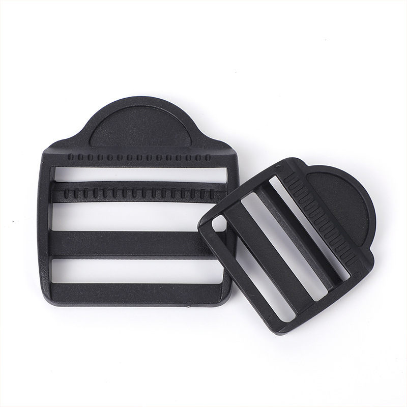 Accesorios de maleta de plástico negro trapezoidal ajustable botón POM mochila botón de botón de banda de tela plana cuatro botones