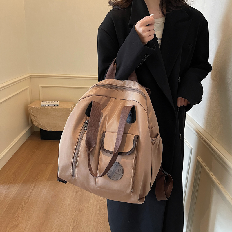 2025 multifuncional simple casual mujer sensación de alto nivel salvaje mochila de viaje de gran capacidad bolso de hombro de mujer multiusos
