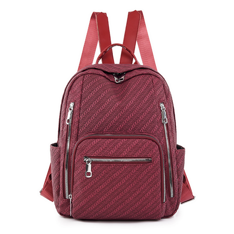 Ventas directas de fábrica 2024 primavera nueva mochila simple de color sólido para mujer mochila de viaje de gran capacidad para viajeros urbanos