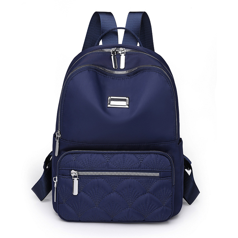 2024 nueva mochila de nailon casual para mujer simple y versátil mochila de viaje ligera al aire libre mochila escolar al por mayor