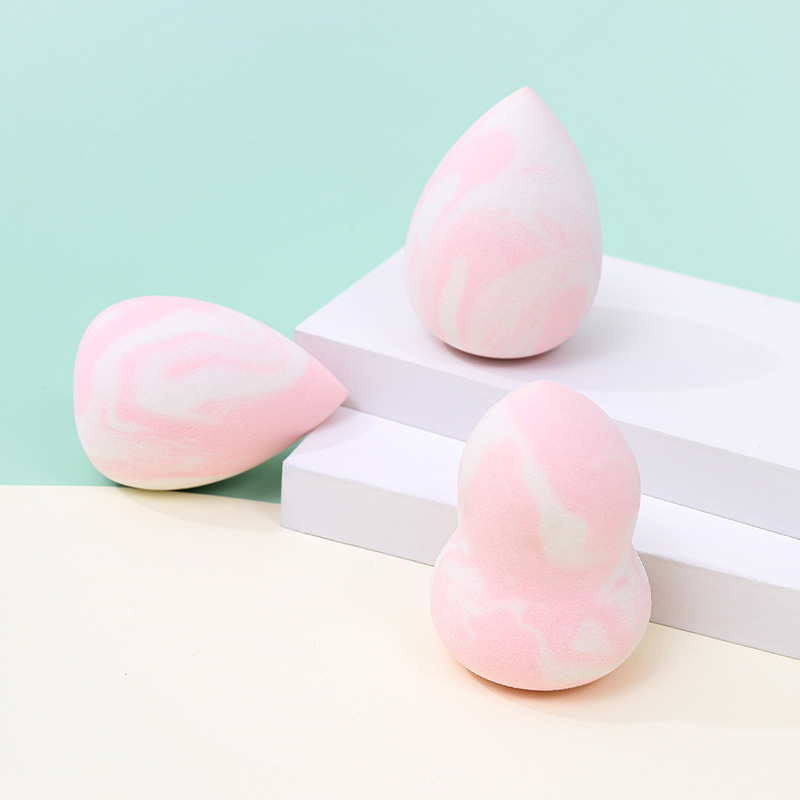 Maquillaje de belleza transfronterizo personalizado de fábrica, soplo de polvo de color mixto, no coma polvo, se agrandará cuando se encuentre con el agua, cojín de aire de esponja de maquillaje seco y húmedo