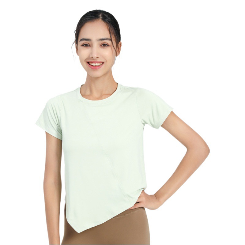 Nuevo verano suelto fitness deportes de manga corta Camiseta de mujer de color sólido europeo y americano de secado rápido irregular yoga Top blusa