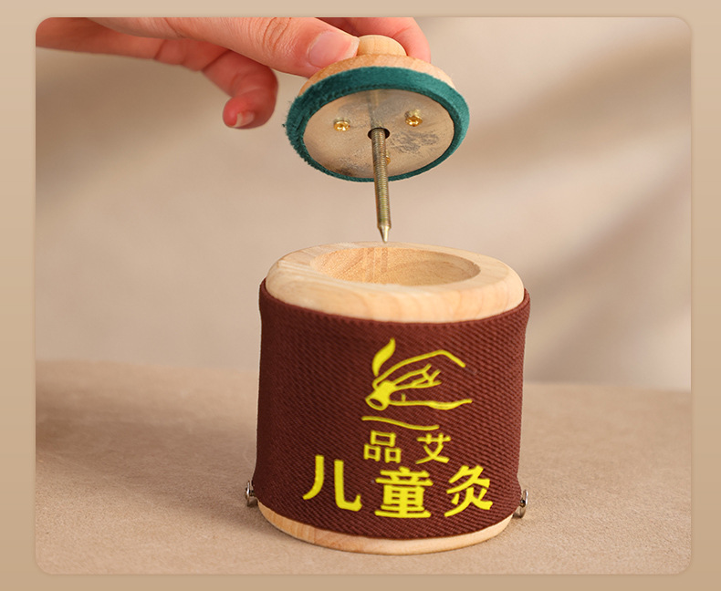 Children Moxibustion Box Home Use Portable Belly Warming Ai Jiu Tool with Small Hanging Moxa Tube in use