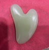 Green [gua sha board]