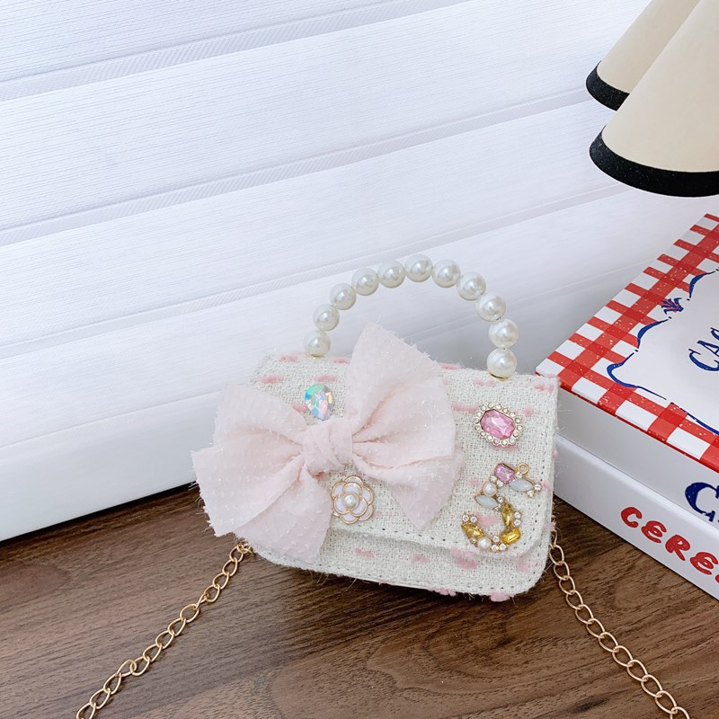 Bolso de cinturón para niños bolso de cambio pequeño viento perla de moda bolso de arco bolso de niña linda