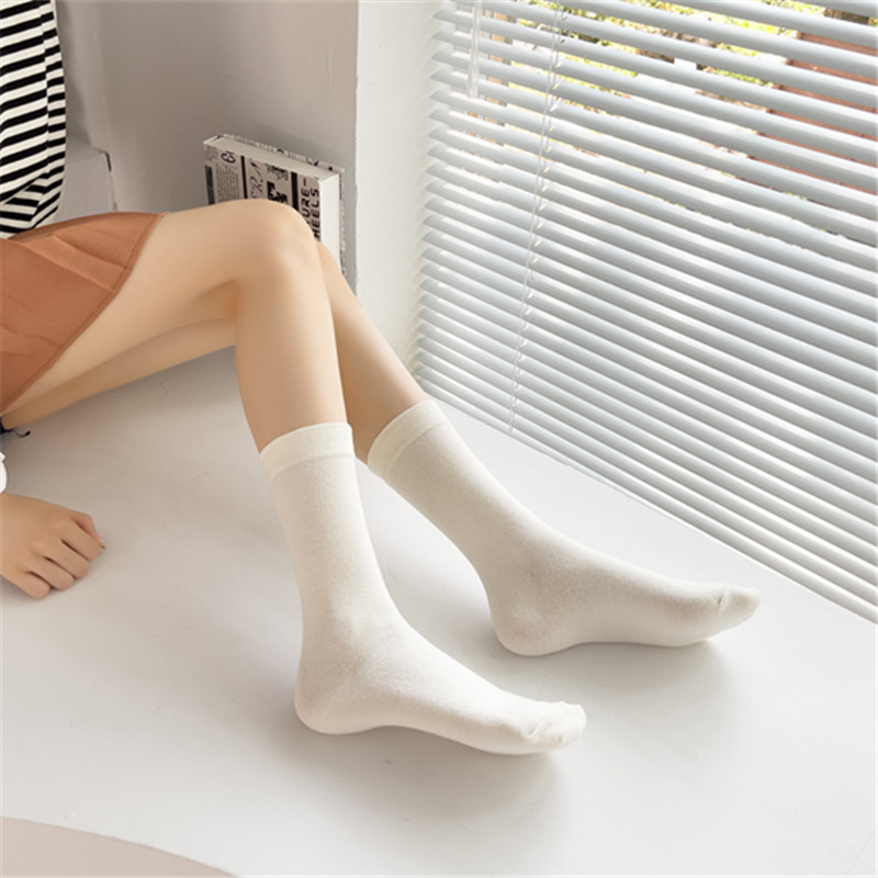 Calcetines de color sólido calcetines de confinamiento de boca suelta de algodón calcetines de pila de media pantorrilla para mujeres al por mayor calcetines de algodón largos transpirables de estilo japonés