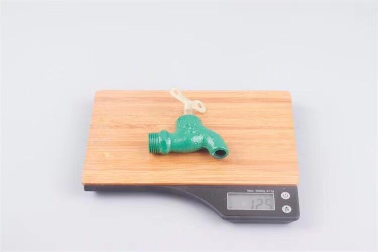Old-fashioned iron faucet with a slow opening time of 4 minutes or 6 minutes and a fast opening time. It is a copper core flat spout cast iron faucet with a key at an outdoor construction site undefined