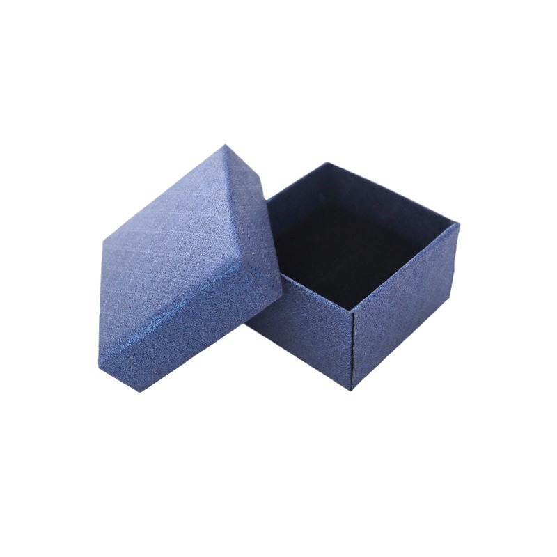 Nueva caja de papel pequeña de margarita, joyería de franela de alta gama, joyería, anillo, pendientes, caja de embalaje universal al por mayor