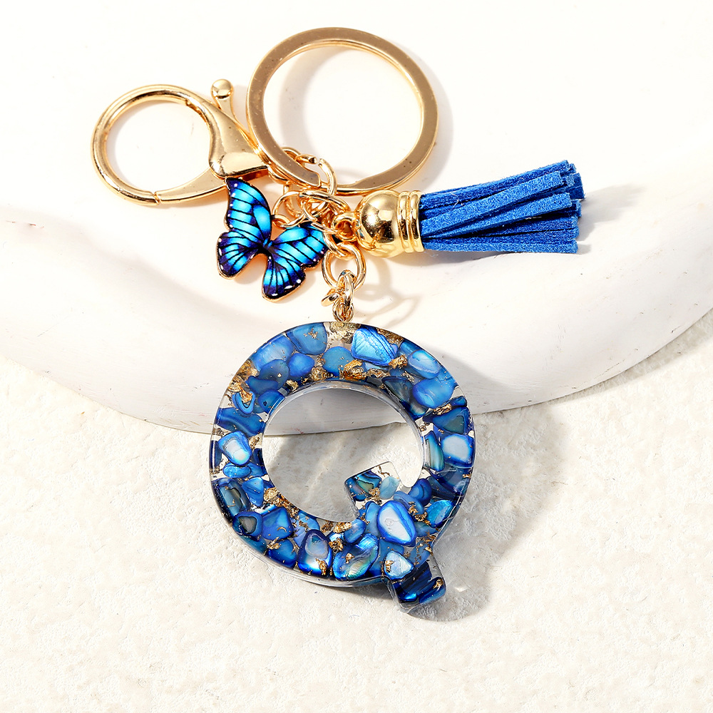 Nuevo transfronterizo mariposa 26 letras inglesas de cristal goteo llavero bolsos accesorios colgante de automóviles