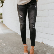 欧美修身黑色破洞弹力压褶牛仔小脚裤