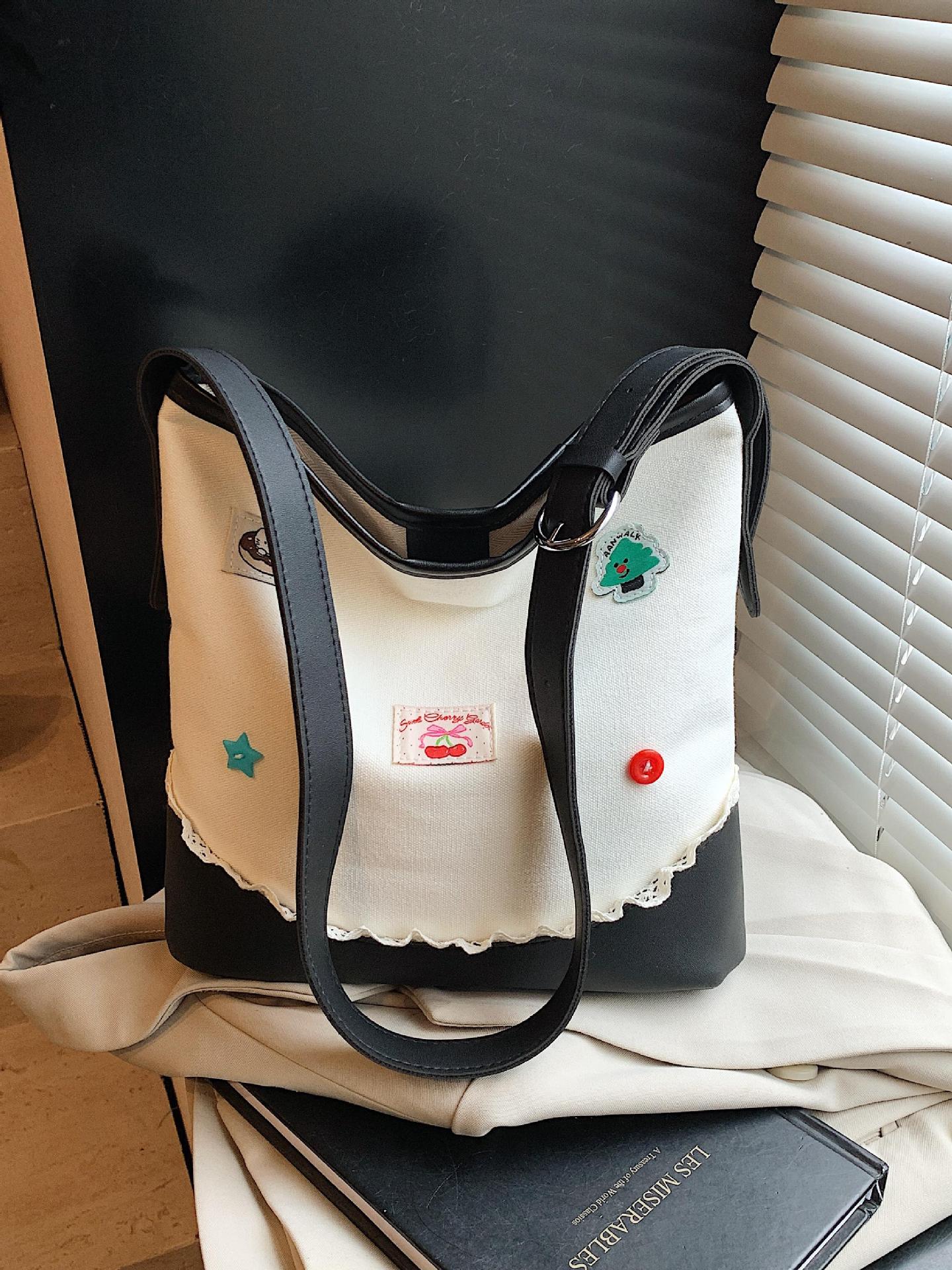 Bolso de cubo de ocio de color de contraste transfronterizo para mujer 2025 nuevo bolso de hombro de tendencia de moda salvaje bolso de mensajero de viaje de trabajo