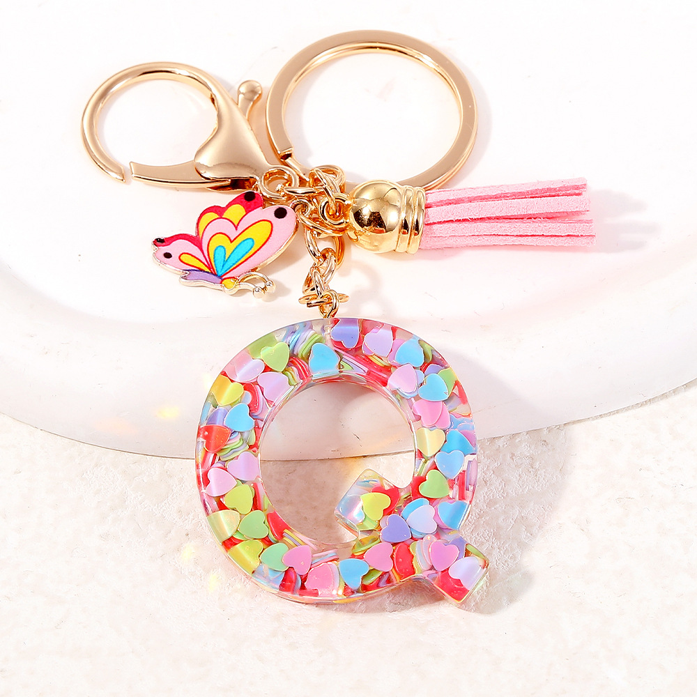 2024 puntos transfronterizos de resina de sequilla rosa 26 letras inglesas llavero colgante mariposa fringe accesorios
