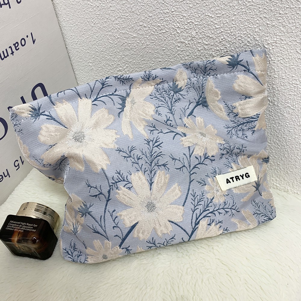 Bolsa de maquillaje una gran cantidad de flores Jacquard tejido Jacquard bolsa de almacenamiento de productos de cuidado de la piel de viaje bolsa de maquillaje portátil