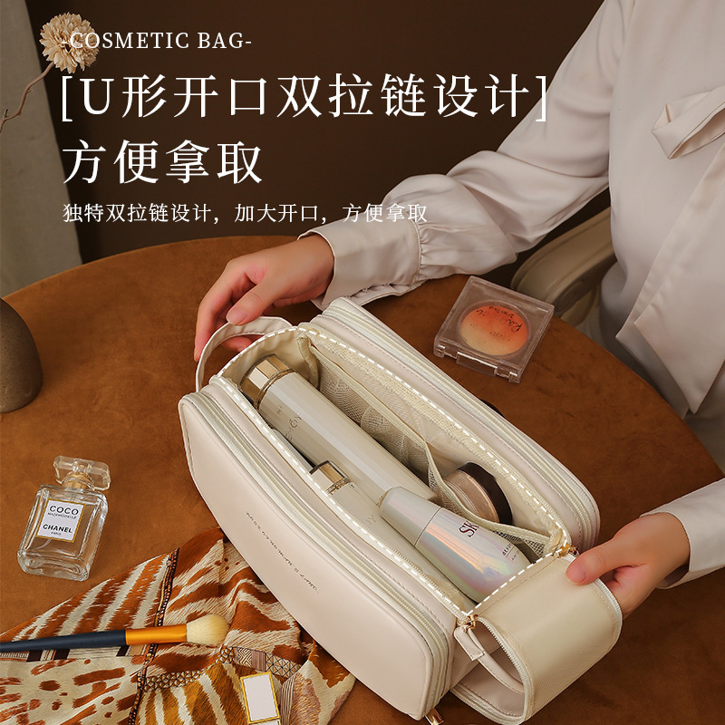 女性のための化粧品バッグ 2025 新しいポータブル大容量トラベルトイレタリーバッグライト高級ハイエンド化粧品パーティション収納袋|undefined