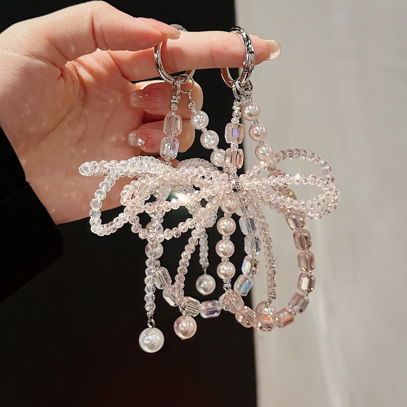 Boutique hecho a mano de alta gama para teléfono móvil cadena corta ins perla mariposa cordón de teléfono móvil de moda colgante de mensajero corto