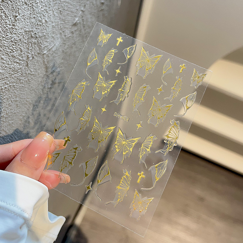 液体の蝶のネイルシールの立体レーザーと金銀の白黒の蝶の薄い靭性帯のゴムを背負って花の爪を貼って卸売りを貼ります。|undefined