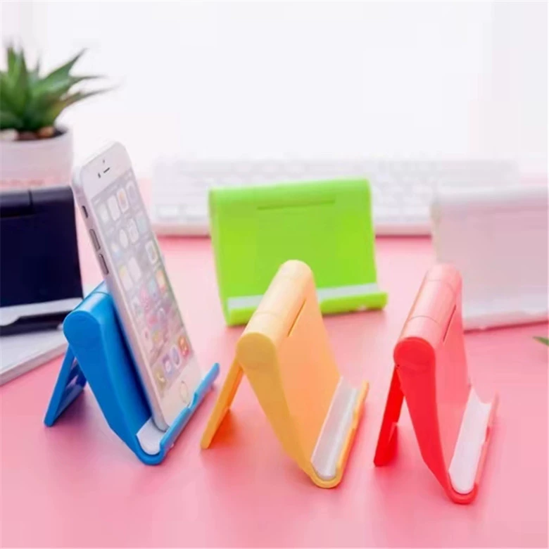 N045B Цветная коробка Складная настольная подставка для телефона + портативный ленивый планшетный телефон Два юаня в универмаге с поставками от 10