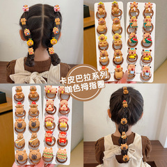 子供のカピバラの髪の輪の女の子はお下げの親指の皮の筋の女の子の赤ちゃんを刺して髪のひもの飾りを傷つけません。